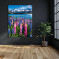 AI art of colorful lupin flowers in front of a blue alpine lake and snow-capped mountains.