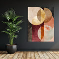 Geometric abstract artwork with gold, rose, and earthy-toned overlapping circular shapes